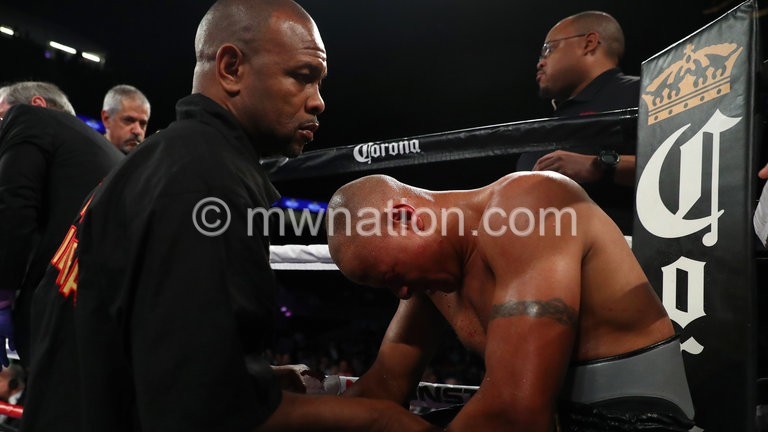 Jones Jnr (L) consoles Chilemba after the stoppage of his fight