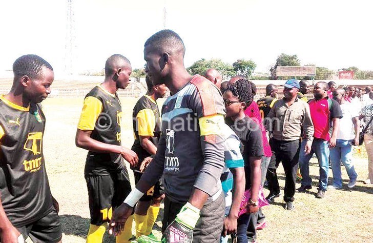 Kamuzu Barracks players wearing TNM branded uniform during a Fisd Cup match