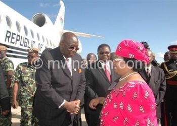 JB bids farewell before boarding the jet, which she later sold