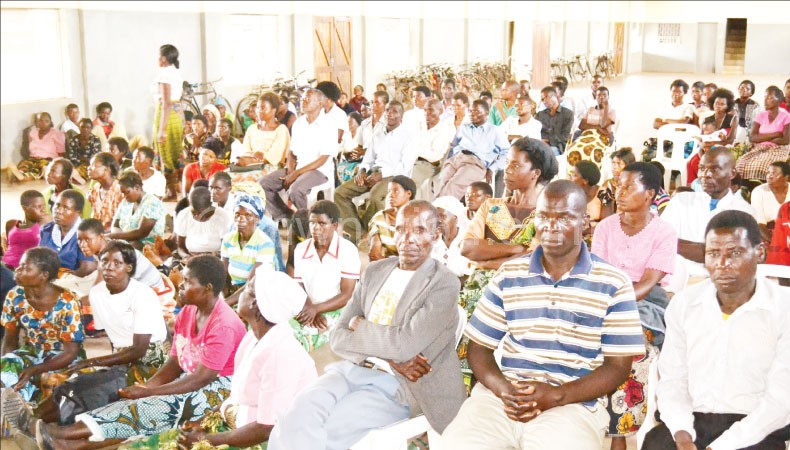 Beneficiaries of the project listening to a presentation during the meeting