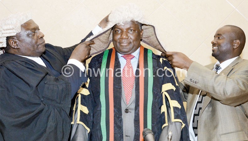 Msowoya being dressed in the Speaker’s garb