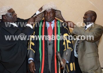 Newly elected Speaker of the National Assembly Richard Msowoya being crowned with the gown of his office after being elected in Lilongwe on Monday