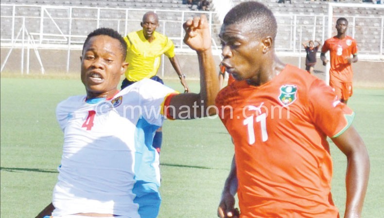Flashback: Kawonga (R) challenges a DR Congo player