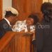 Treza Senzani (In White) consulting with her lawyer, Mhura