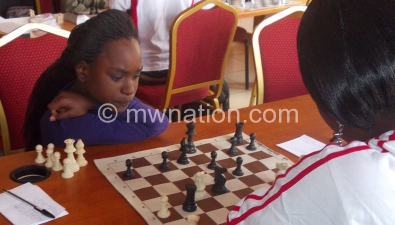Some women participate in the chess game