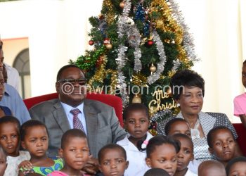 The first couple with children at a recent Xmas party