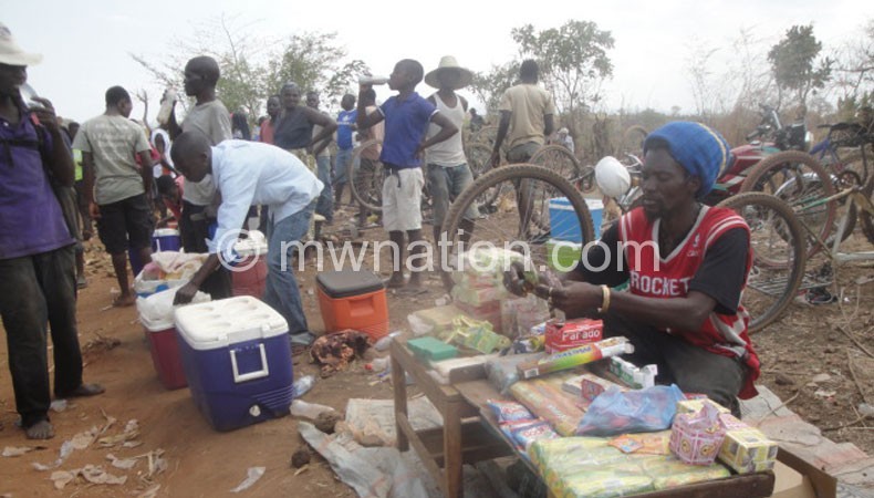 A vendor sells  merchandise at the mining site