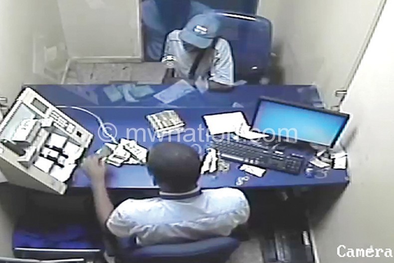 Kondowe’s mysterious depositor (in baseball cap) in this screen grab from CCTV
footage seen by The Nation
