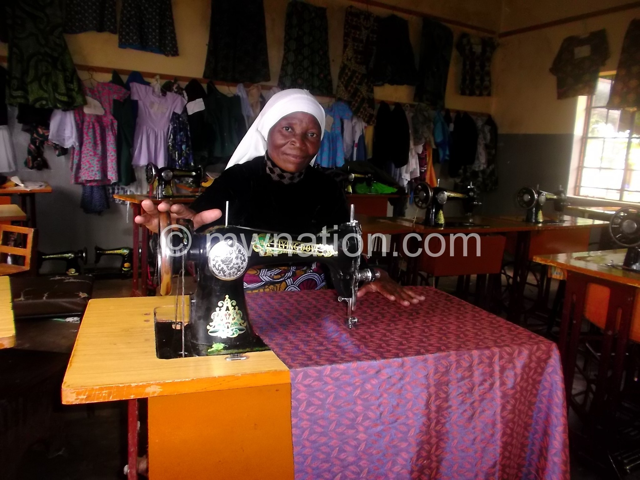 A woman on her machine in a tailoring