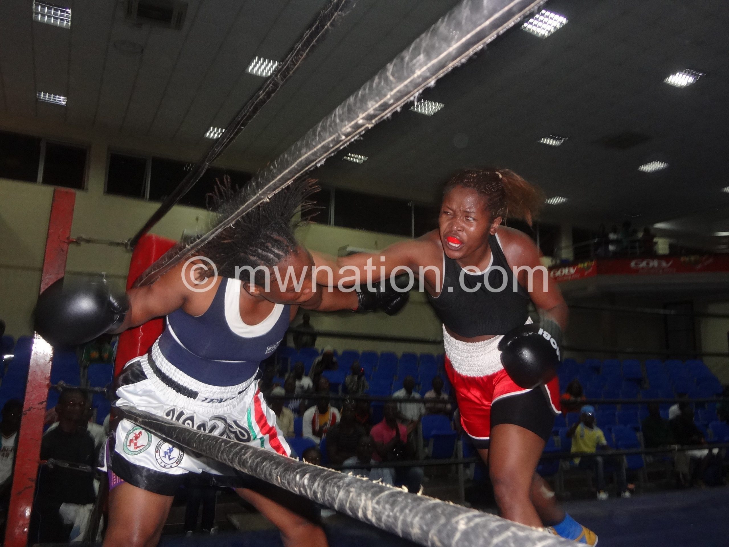Mtimaukanena (R) lands a punch on Mhubira in the previous fight