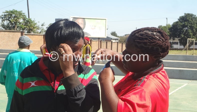 Queens coaches Chawinga-Kalua (L) and Waya discuss during training on Monday