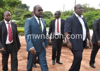 Mphwiyo (2nd from L) with sympathisers during an 
earlier court appearance