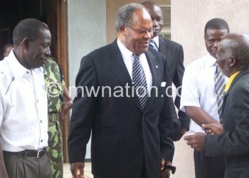 Muluzi sharing a lighter moment with sympathisers after an earlier 
court adjournment