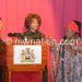 Mutharika (L) joins Chidzanja-Nkhoma in song as Chilima (C) looks on