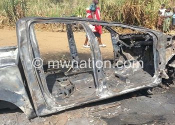 Njauju’s car (above) was burnt to ashes during the incident