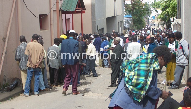 Ex-miners outside Credit Data Offices in Blantyre pressing for their pensions