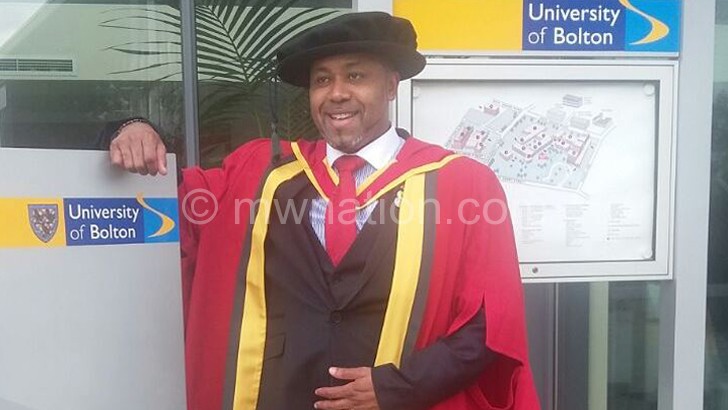 Chilima takes a pose at the University of Bolton after attaining his PhD