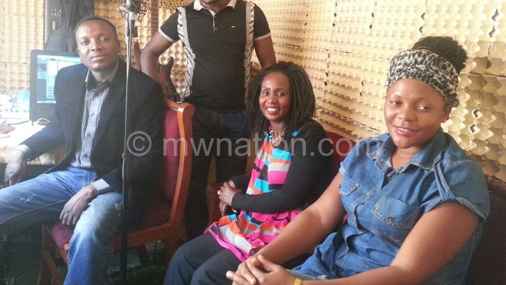Away from the stage, Tembo pictured in the studio with musicians Mlaka Maliro (L), 
his wife Bernadetta (R) and Ethel Kamwendo Banda (2nd-R)
