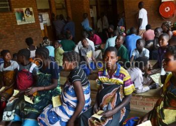 Patients queue in hospital as they await treatment