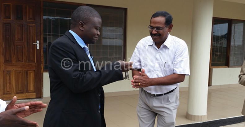 Here you are: Pillai (R) hands over keys to Kampalume