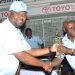 Nthakomwa (left) receiving a trophy from PCL board chairperson Simon Itaye