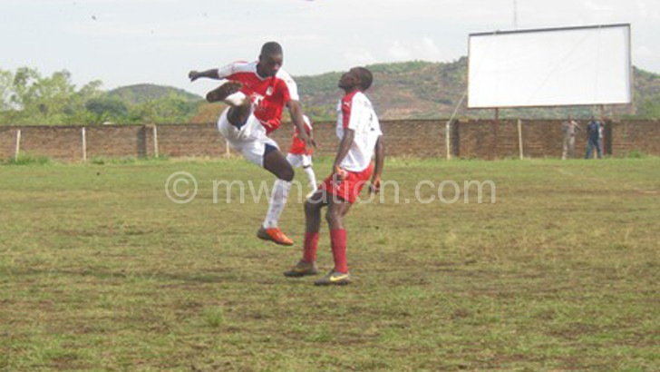 Bokosi (L) flicks the ball as an
 opponent looks on