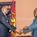 Mutharika greets Wiseman Chijere Chirwa during a meeting with media managers and owners over ATI