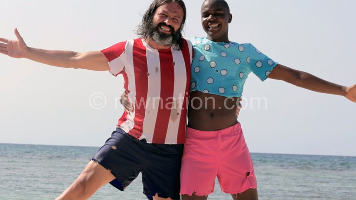 Nyambi (R) starring with Serhat Kılıç in a scene from Robinson Crusoe and Friday