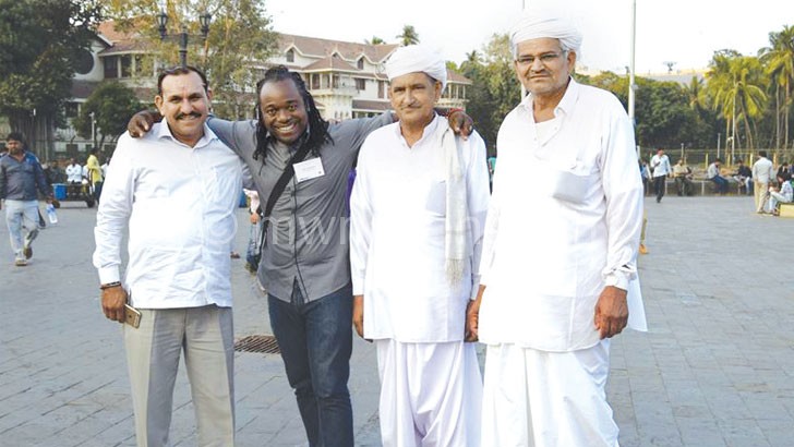 India-bound: Kambalu posing with colleagues during a cultural exchange visit
