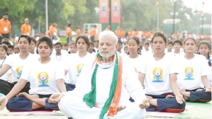 Indian Prime Minister Narendra Modi (C) leads a mass session to mark the day in Delhi yesterday