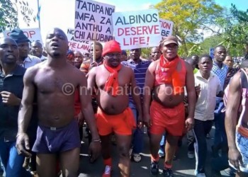 Member of Parliament Bon Kalindo (2L) led ‘naked’ protests to raise
awareness of the plight of people with albinism