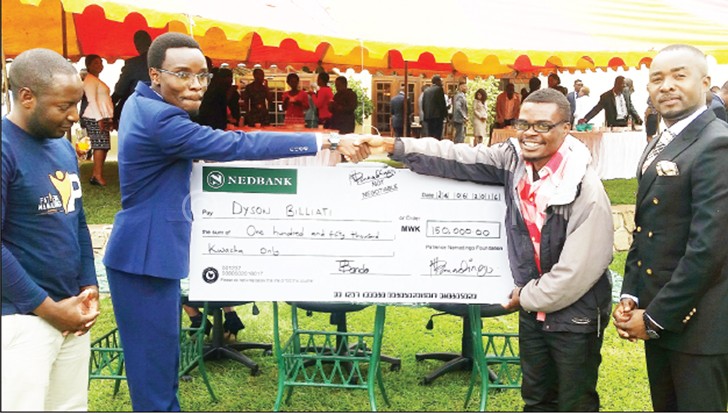 Namadingo (2nd L) presents a dummy cheque to Billiat (2nd R)