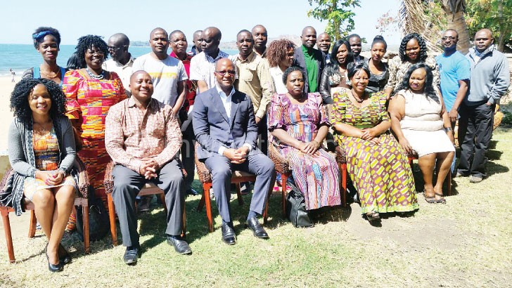Journalists and ministry officials captured on the sidelines of the workshop