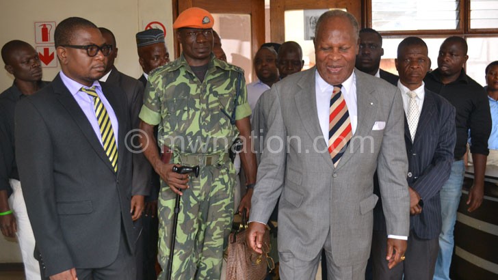 Muluzi walks out of the court premises during a previous hearing