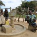 A man with a disability pushing a borehole