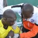 Ngulube (L) being treated by Wanderers team doctor during the Carlsberg Cup final