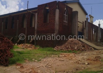 The new Bangwe Parish church being built around the old structure
