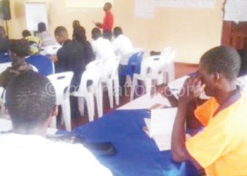 Youths listening to the presentation