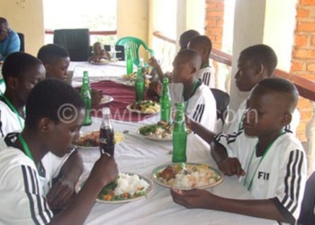 The youngsters enjoy their sumptuos  meal