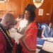 Zomba mayor Melia Douglas helps Maunde put on the deputy mayor’s gown