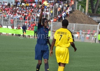 Last man standing: Chizinga (L) captured in the line of duty in a previous local match