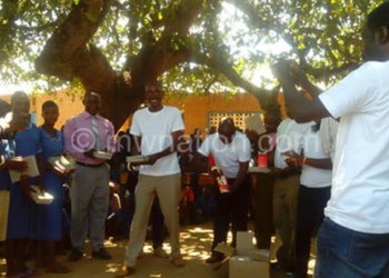 Bwiba alumni donating the books