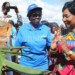 Mutharika (R) interacts with Omondi after unveiling a plaque