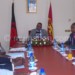 Mutharika (C) discussing with the vendors’ representatives as presidential adviser on economic affairs Collins Magalasi (R)listens