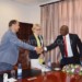 Msowoya (R) greets EU head in Malawi Marchel Gerrmann as EUEFM
leader of delegation Birgittee Markussen looks on