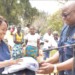 NPL chairperson Mbumba Banda Snr receives a symbolic donation of
items from UNFPA country representative Dan Odallo
