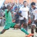 Wanderers midfielder Yamikani Chester (R) tries to beat Moyale’s Mtopijo Njewa
