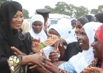 Mutharika (L) interacts with some of the women after 
the opening of the Ijtmah