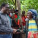 Chakwera cheers an old woman at Kaliyeka whose house was entirely demolished in the Saturday night floods