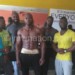 Kamanga (2ndL) and other bodybuilders pose for a photo
